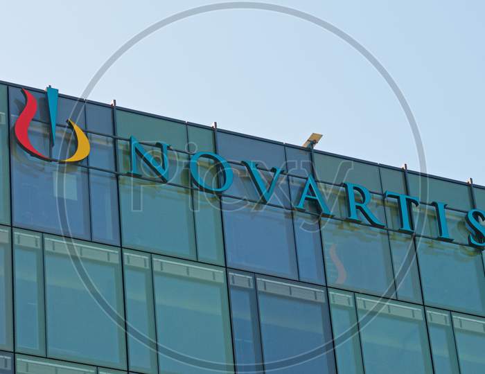 Novartis Sign Hanging At The Building In Rotkreuz, Switzerland