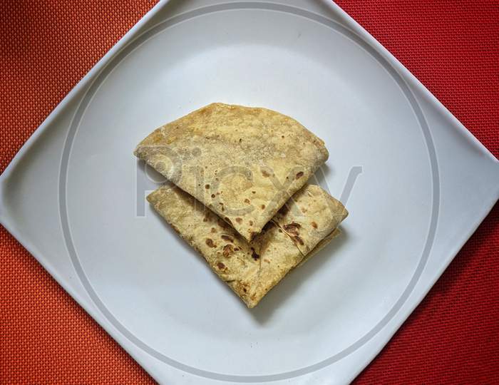 Indian Chapati / Fulka/Pulka Or Gehu Roti On White Plate. It'S A Healthy Fiber Rich Traditional Indian Food.