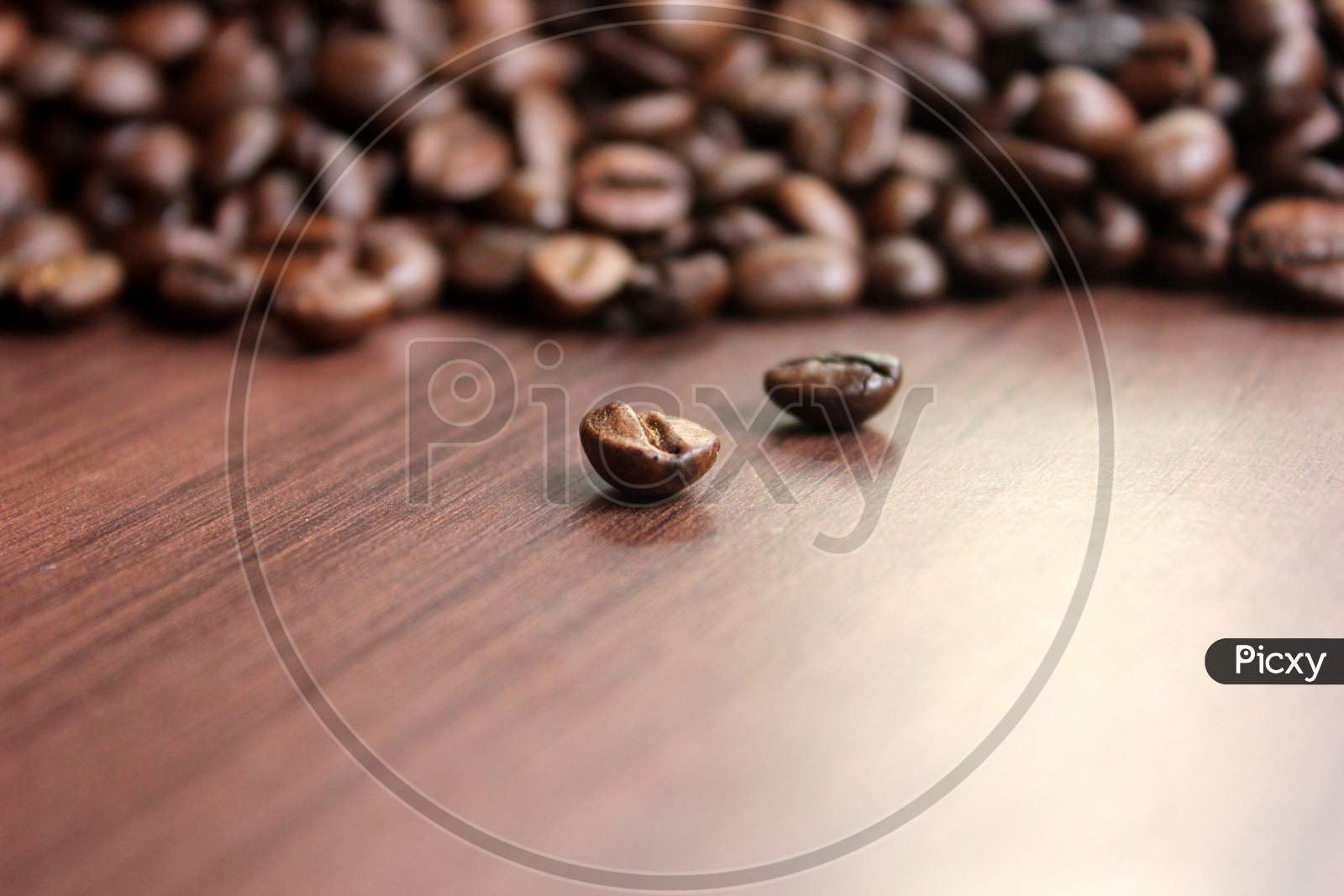 Rosted Coffee Beans On Top Of The Table