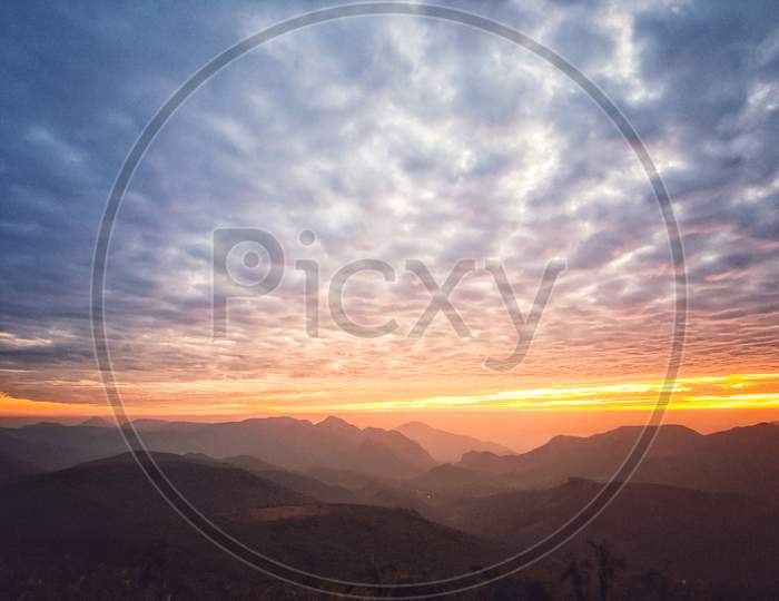Beautiful Orange Colour With Clouds Sunset View In The Montain Of Deomali, India
