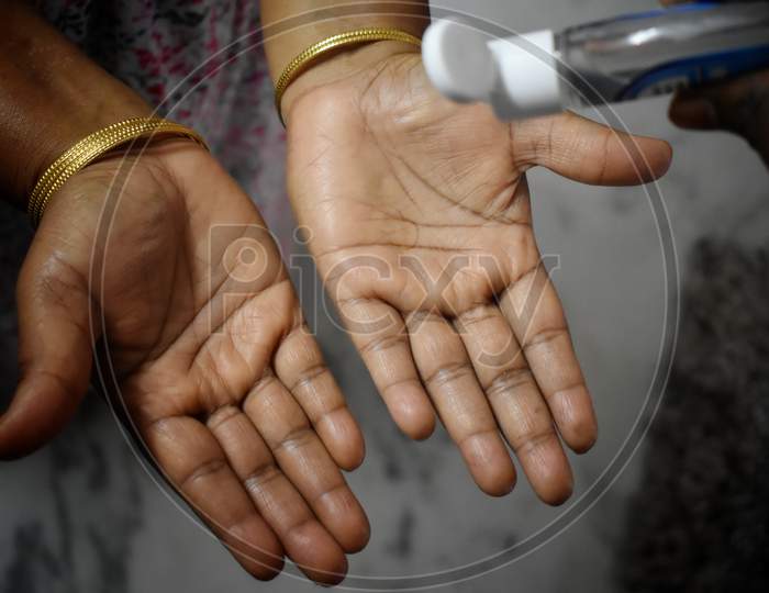 Women Washing Hands With Alcohol Gel Or Antibacterial Soap Sanitizer After Using A Public Restroom.Hygiene Concept. Prevent The Spread Of Germs And Bacteria And Avoid Infections Corona Virus,India.