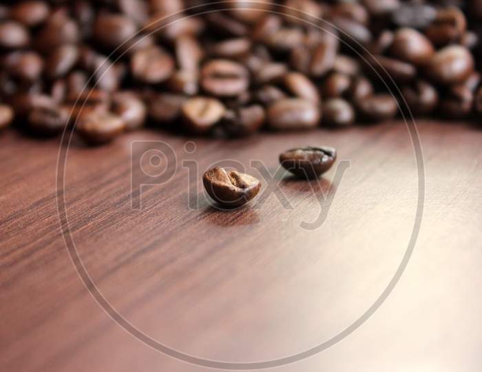 Rosted Coffee Beans On Top Of The Table