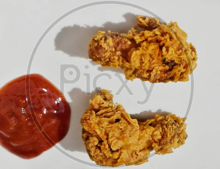 Baked Chicken Wings Served With Different Sauces And Lemon. White Background, India