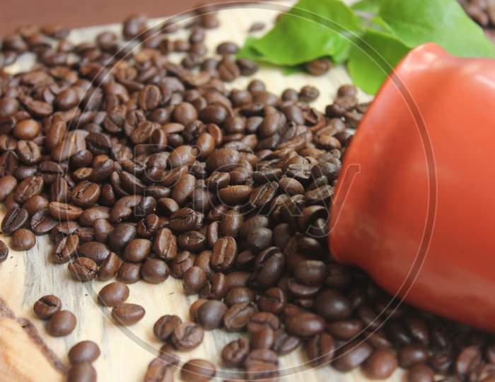 Closeup Of Roasted Coffee Beans On Top Of The Table