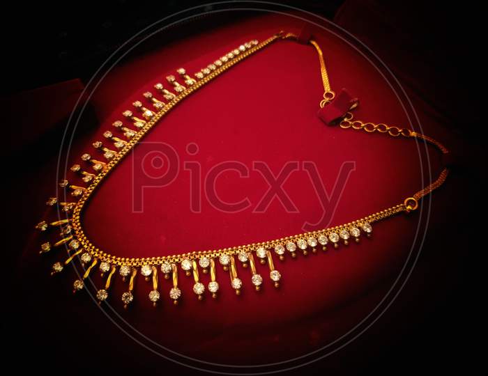 Accessory Gold, Jewelry Presentation In Shop, Gold Necklace On Mannequin, India.