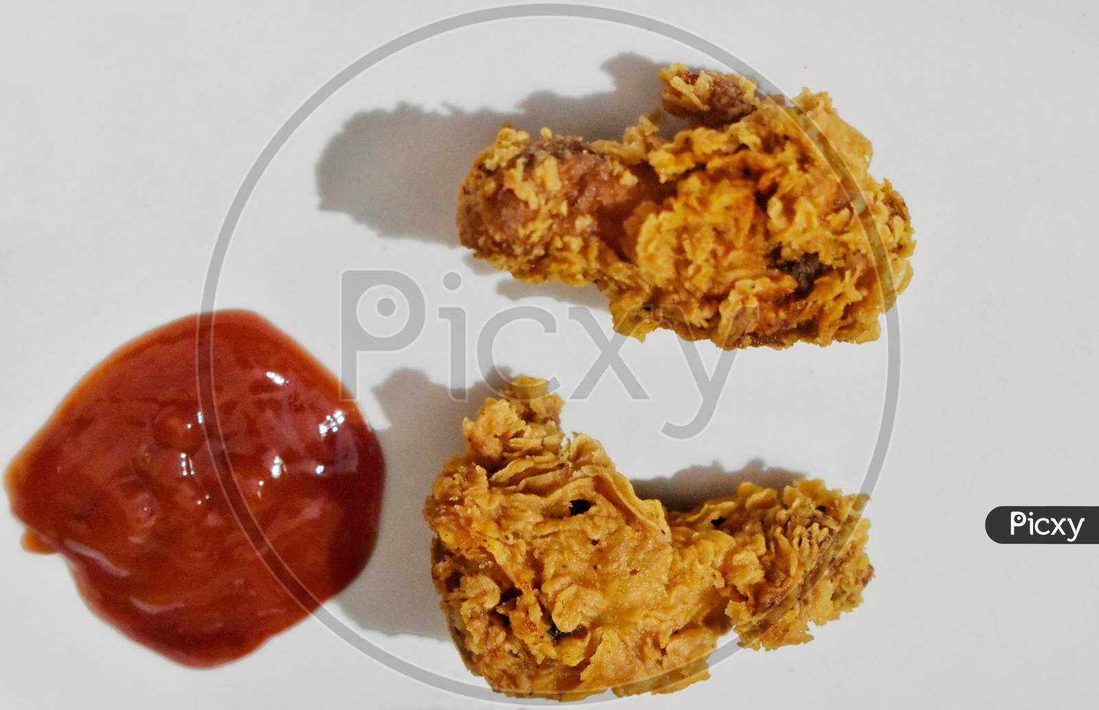 Baked Chicken Wings Served With Different Sauces And Lemon. White Background, India