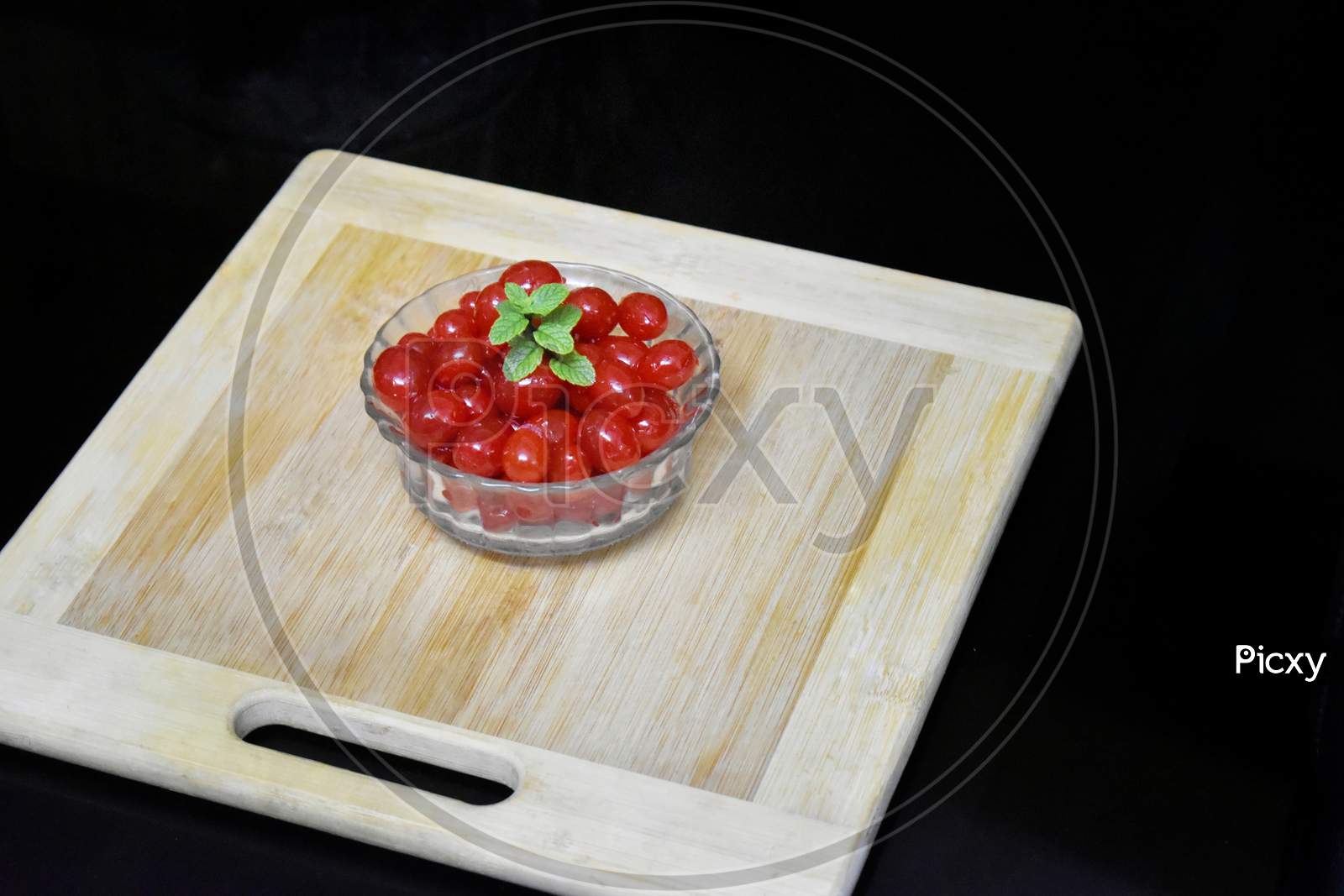 Cherries On Wooden Table With Water Drops Macro Background