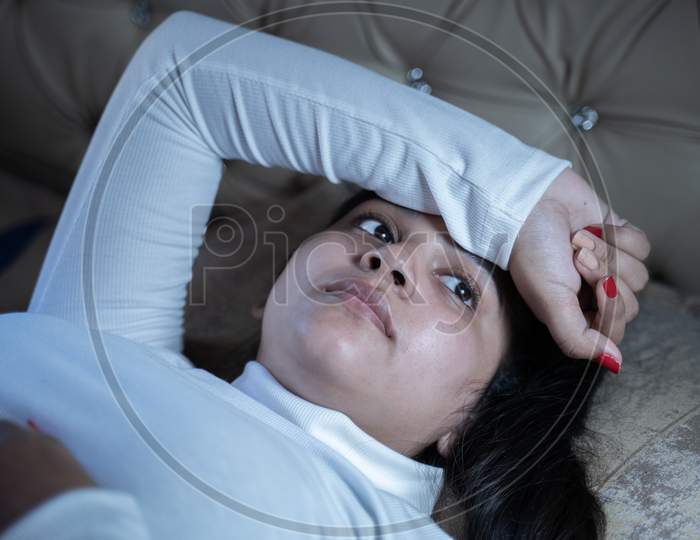 Concept Of Insomnia Or Sleeping Problem Or Depression - Worried Young Girl With Eyes Open Not Able To Sleeping During Nights