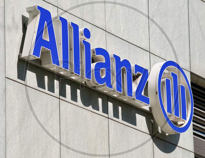Allianz Company Sign Hanging On A Building In Lugano