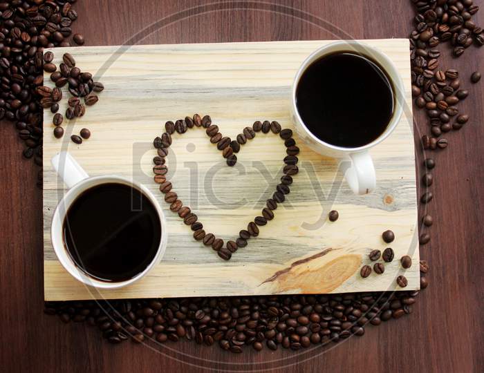 Coffee Beans With A Heart Symbol Stock Photo