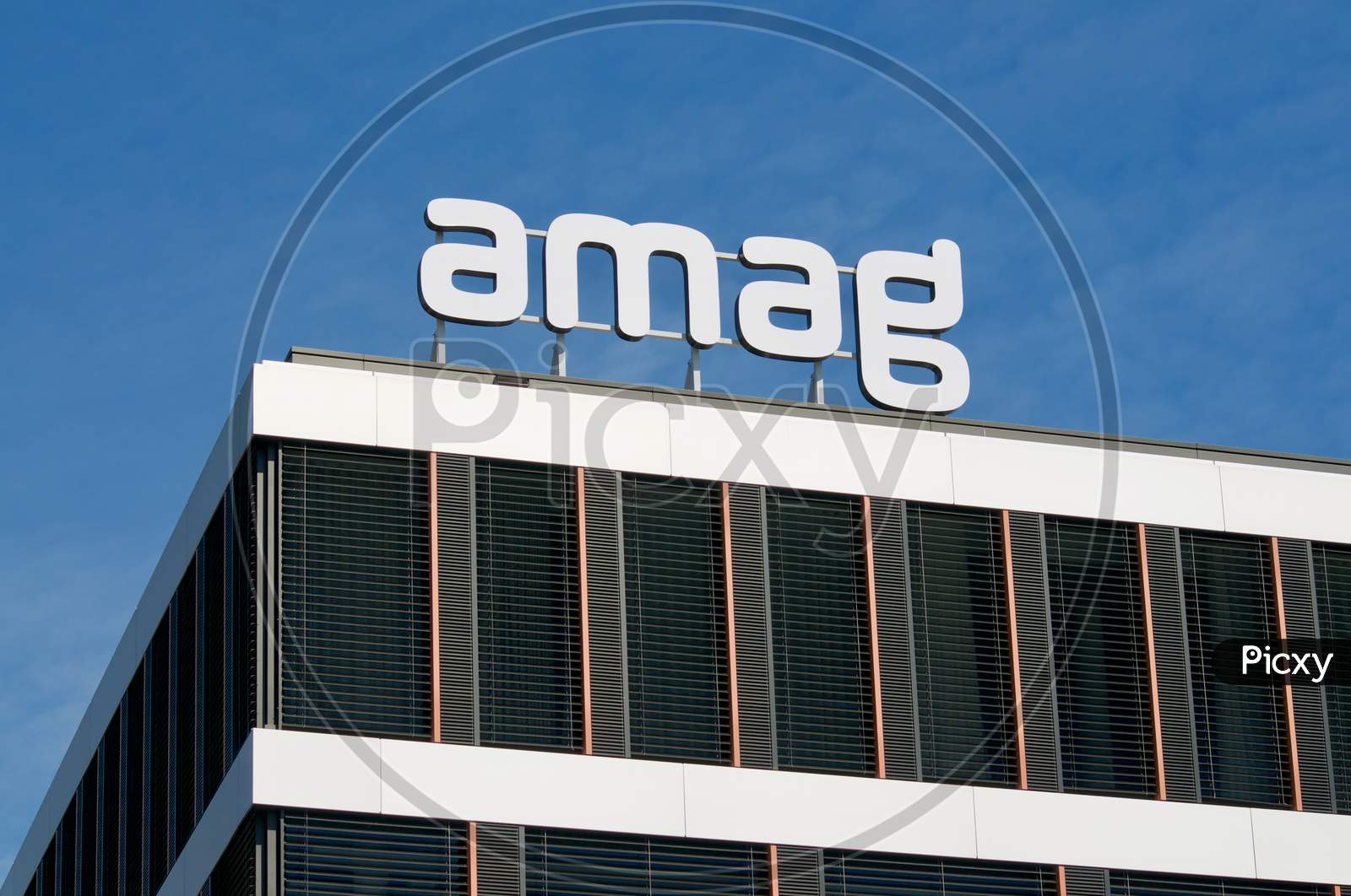 Amag Group Sign Hanging At Headquarters Building In Cham, Switzerland