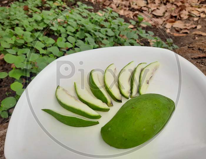 fresh green mango with slice.