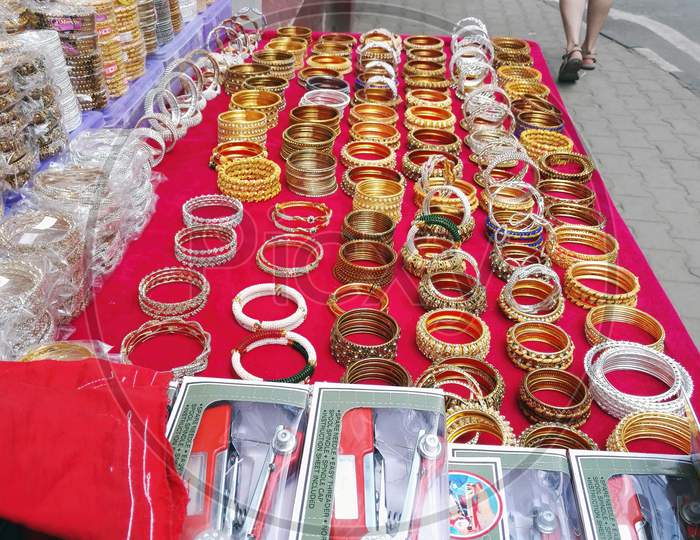 Bangalore, India - October 08, 2017: Traditional Indian Bangles With Different Colors And Patterns On Table Next To Street For Display And Selling
