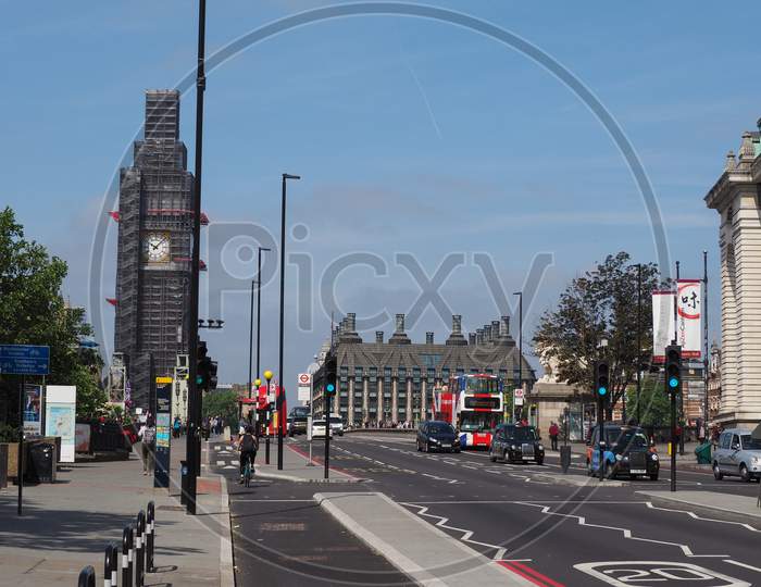 London, Uk - Circa June 2018: View Of The City With Woman Cycling And Black Cabs On Westminster Bridge