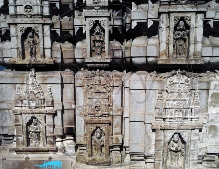 Varanasi, India - November 01, 2016: Ancient Temple Wall Made Of Stone With Ancient God Carving And Pattern. Uttar Pradesh.