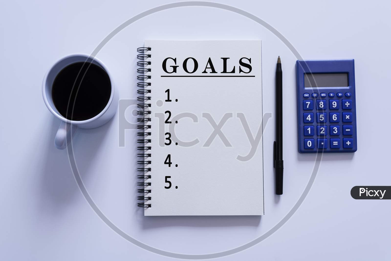 Text On Notepad With Pen, Calculator And A Cup Of Coffee On White Background