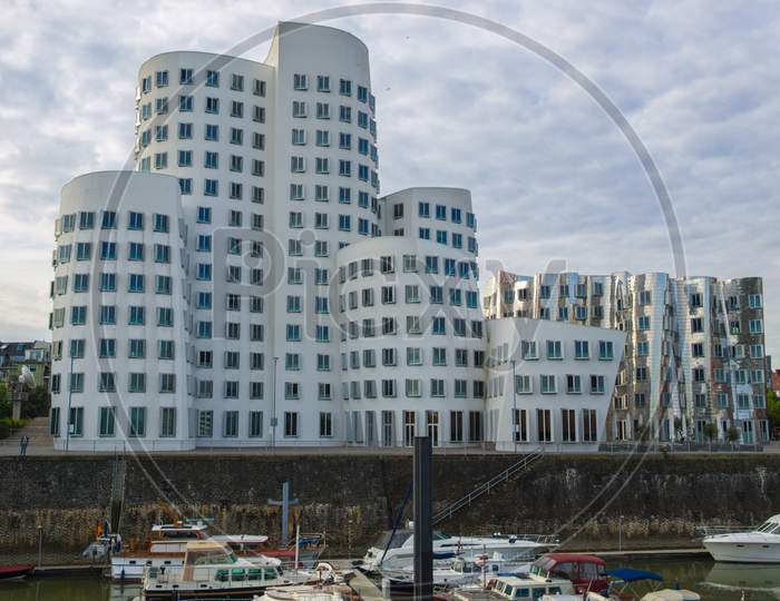 Duesseldorf, Germany - August 03, 2009: The New Medienafen Is A Redevelopment Area In The Former Docklands And Harbour With Buildings Designed By Steven Holl, David Chipperfield And Frank O Gehry