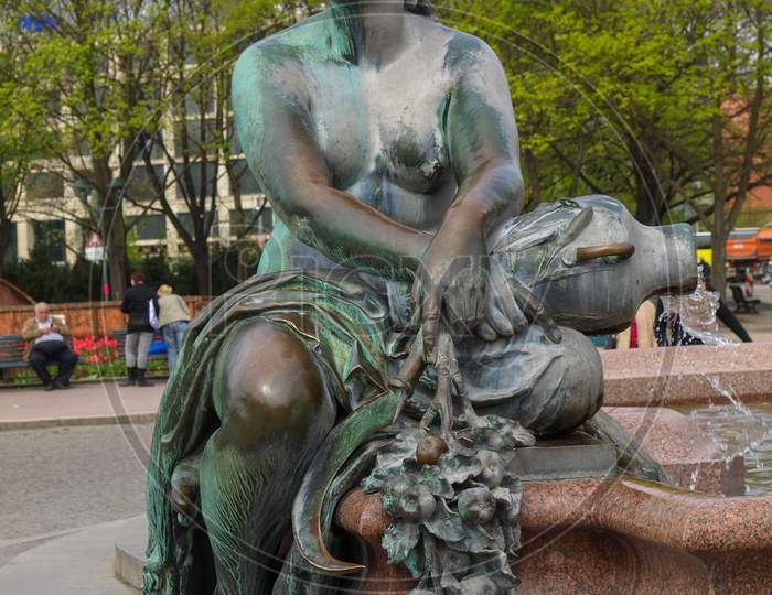 Berlin, Germany - April 24, 2010: The Neptunbrunnen (Neptune Fountain) In Alexanderplatz Was Designed By German Sculptor Reinhold Begas In 1891