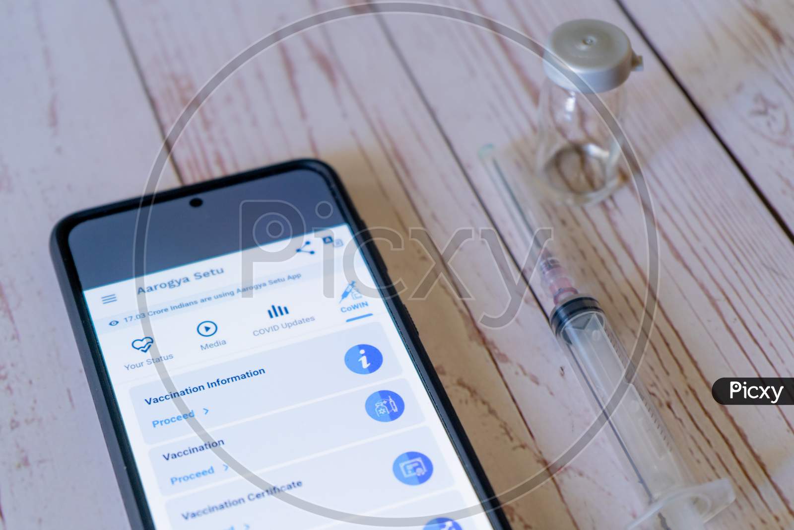 Mobile Phone With Arogya Setu Co-Win App Application Showing Vaccine Tracking Used By Patients And Doctors To Ensure Quick Distribution And Tracking During The Covid19 Coronavirus Pandemic As India Struggles With Lockdowns