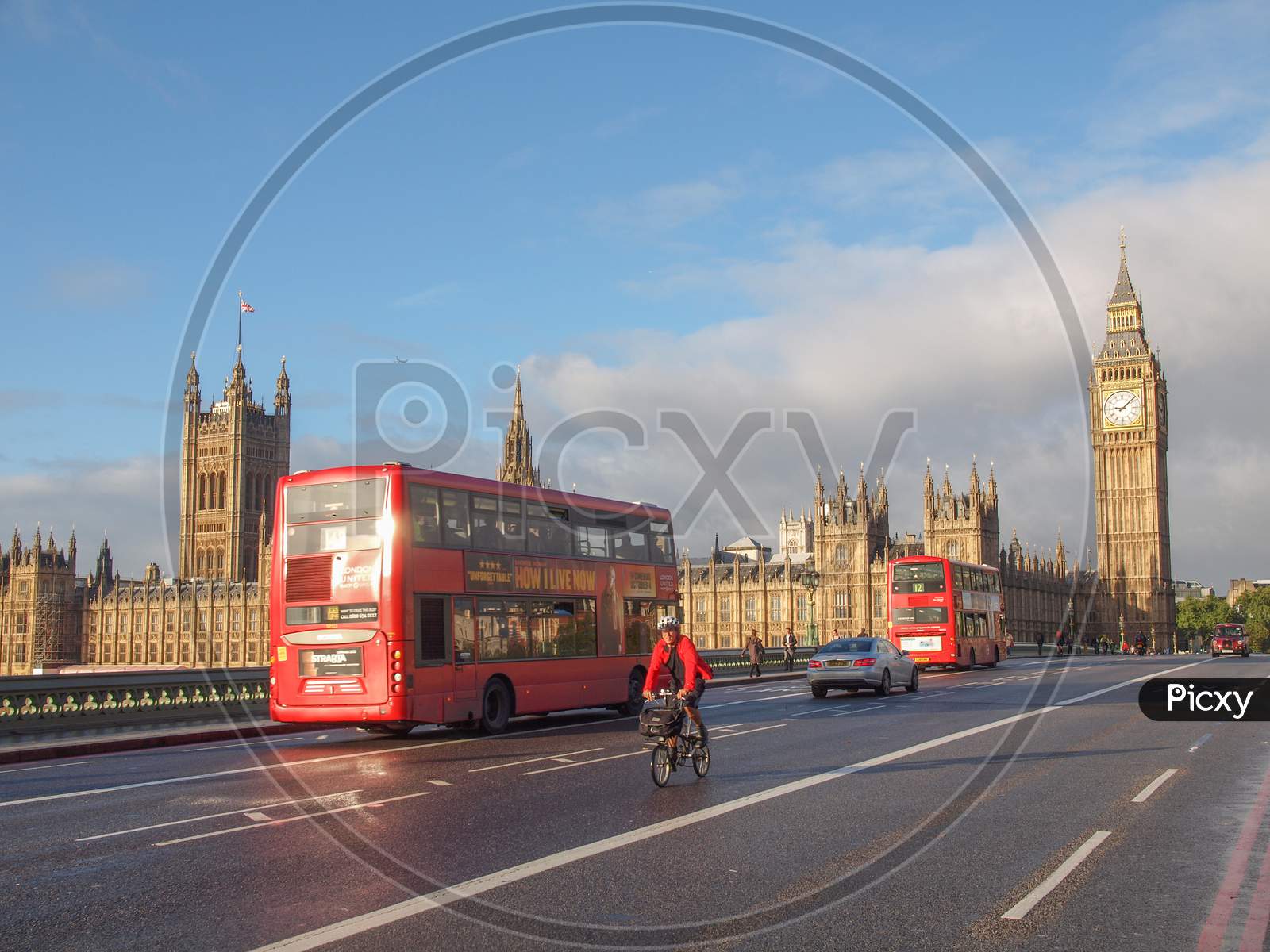 London, England, Uk - October 23: Double Decker Bus Crossing The World Famous Westminster Bridge In Front Of The Houses Of Parliament On October 23, 2013 In London, England, Uk
