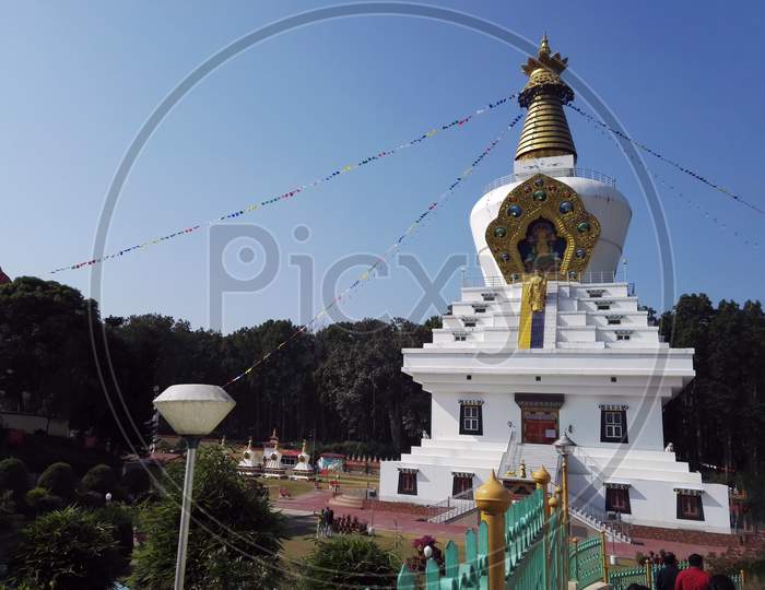Dehradun, India - November 04, 2016: Statue Of Lord Buddha Monastery Temple With Golden Stupa On Top, Located In Uttrakhand, South Asia