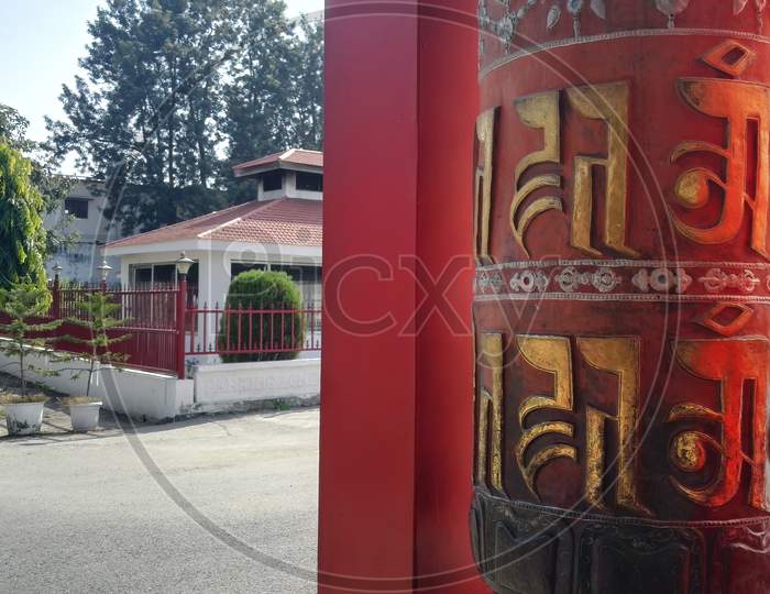 Dehradun, India: Prayer Wheel With Bell With Language Of Tibetan, A Cylindrical Wheel, Mantra Om Mani Padme Hum , Vertical Image, Uttrakhand