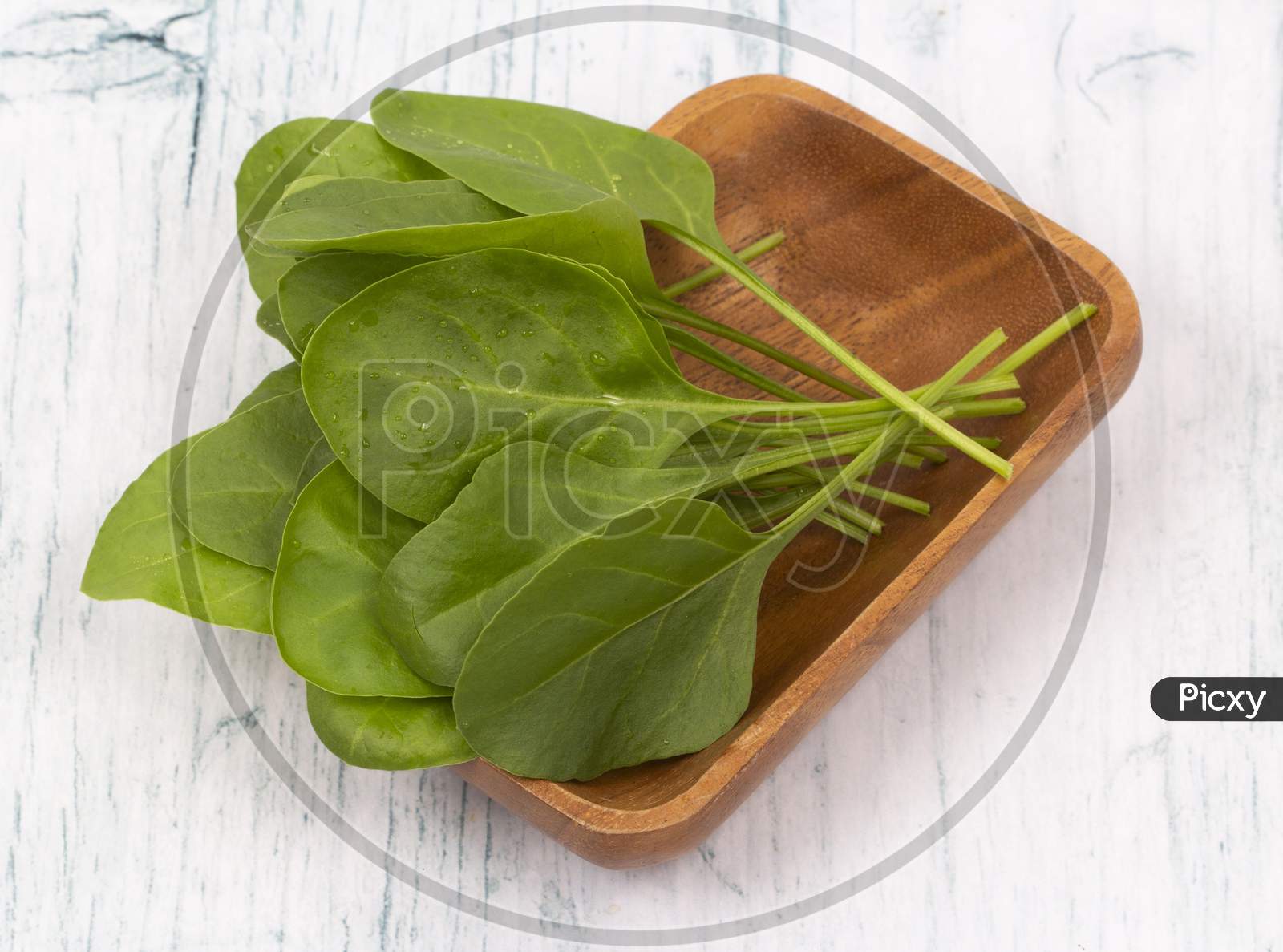 Baby Spinach Leaves In Wooden Bowl