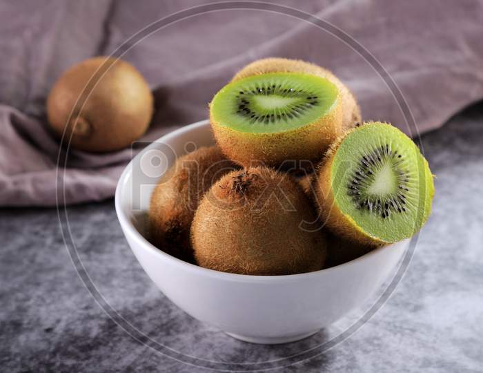 Organic Healthy Kiwi Fruit In A White Bowl