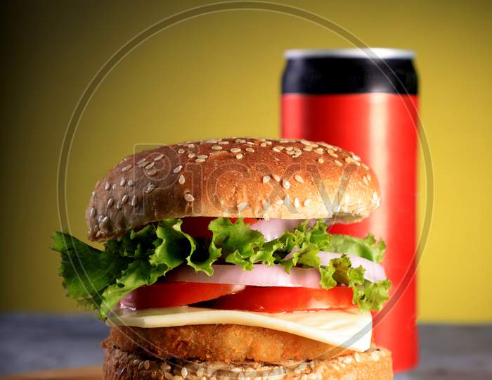 Fast Food Burger With A Cold Drink Can