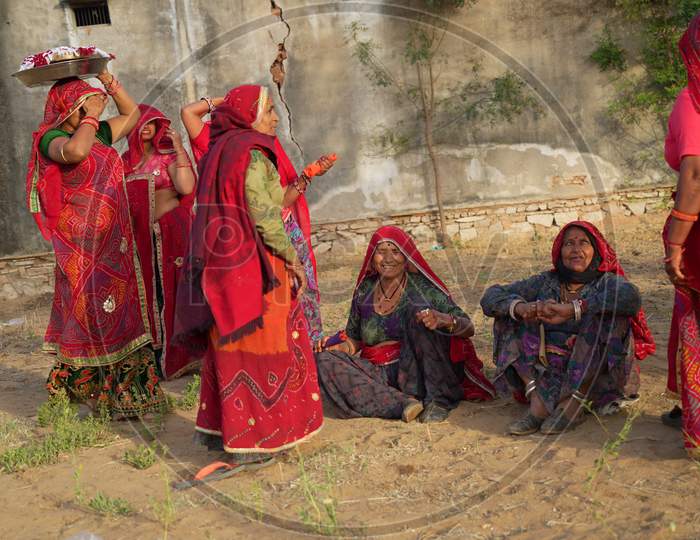 Traditional Navratri Festival In India. Rural Women Offering Prayer In Traditional Attire. Rural Cultured Women Closeup Shot.