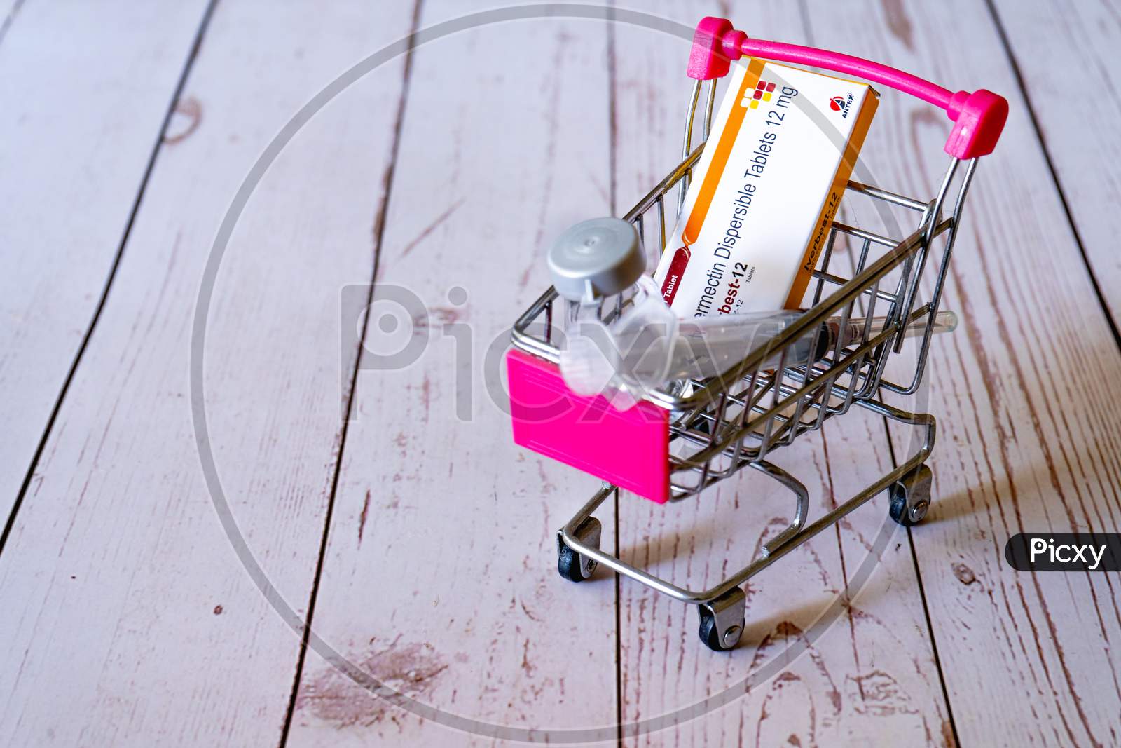 Mini Shopping Cart With A Dose Of Ivermectin Iverbest Tablets With A Syringe And Vial Ampoule Showing Care For Covid19 Coronavirus At Home Available For Purchase Online