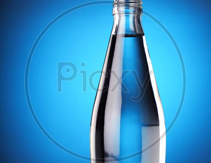 The Bottle Cap Challenge Concept - Fresh Water In A Bottle With Open Cap Flying
