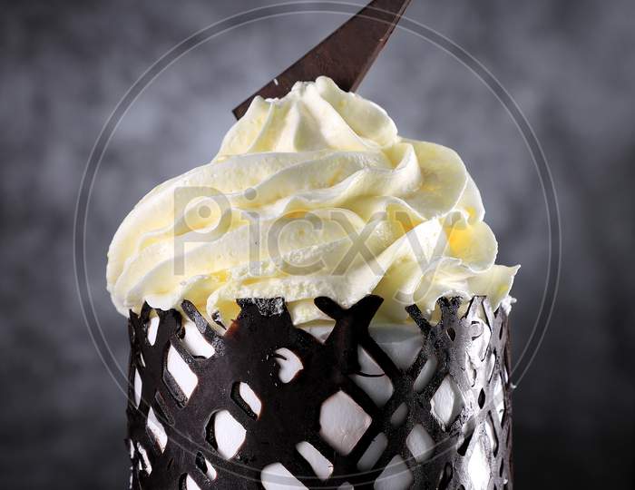 Dessert - A Sweet Cake With Chocolate And Cream