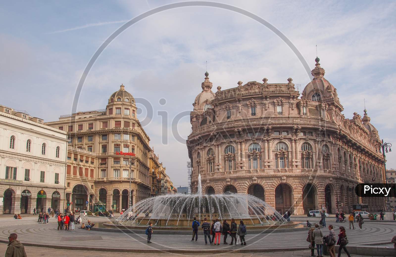 Genoa, Italy - March 16, 2014: Tourists Visiting Piazza De Ferrari Main Square And Fountain