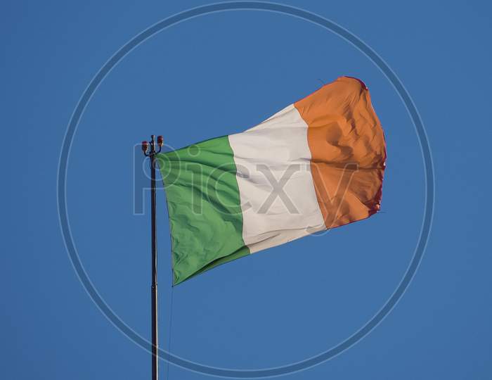 Irish Flag Of Ireland Over Blue Sky