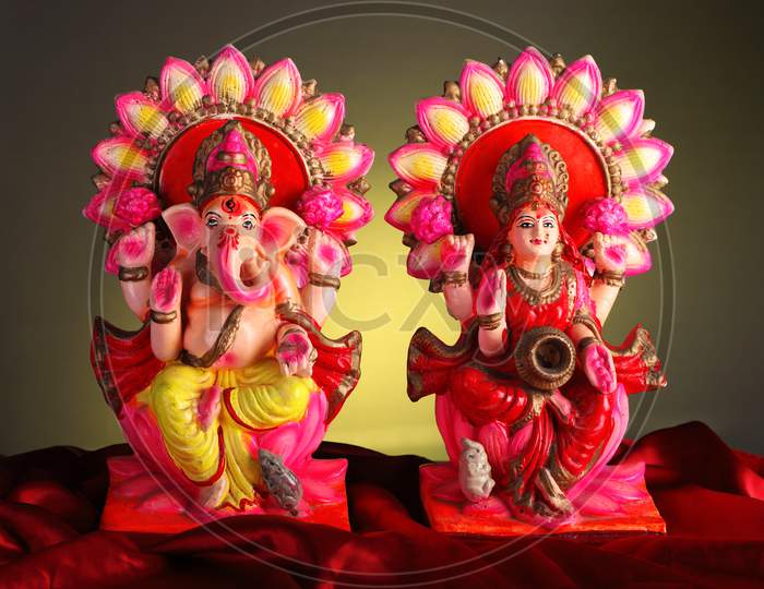 Beautifully Decorated Lord Ganesha And Goddess Laxmi Idols / Statue