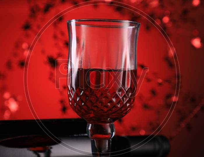 Red Wine Bottle And Glasses With Festive Holiday Feel
