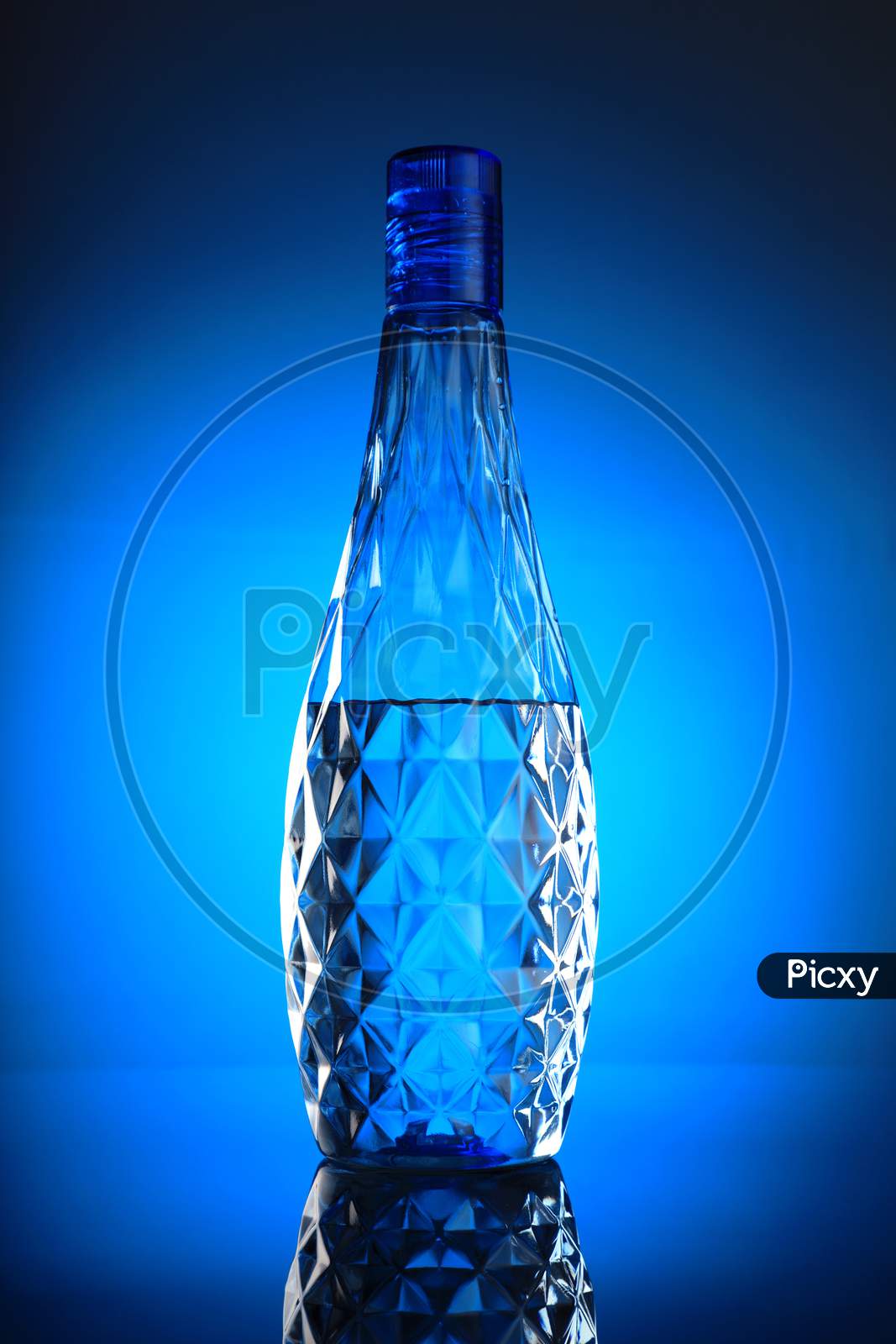 Clean And Pure Mineral Drinking Water In A Blue Bottle