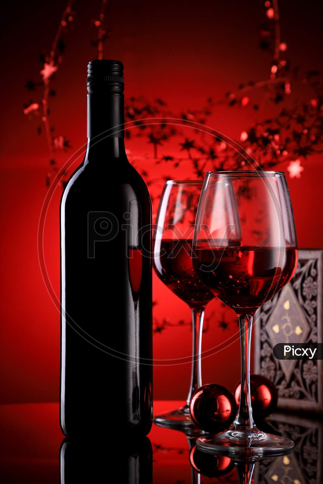 Red Wine Bottle And Glasses With Festive Holiday Feel