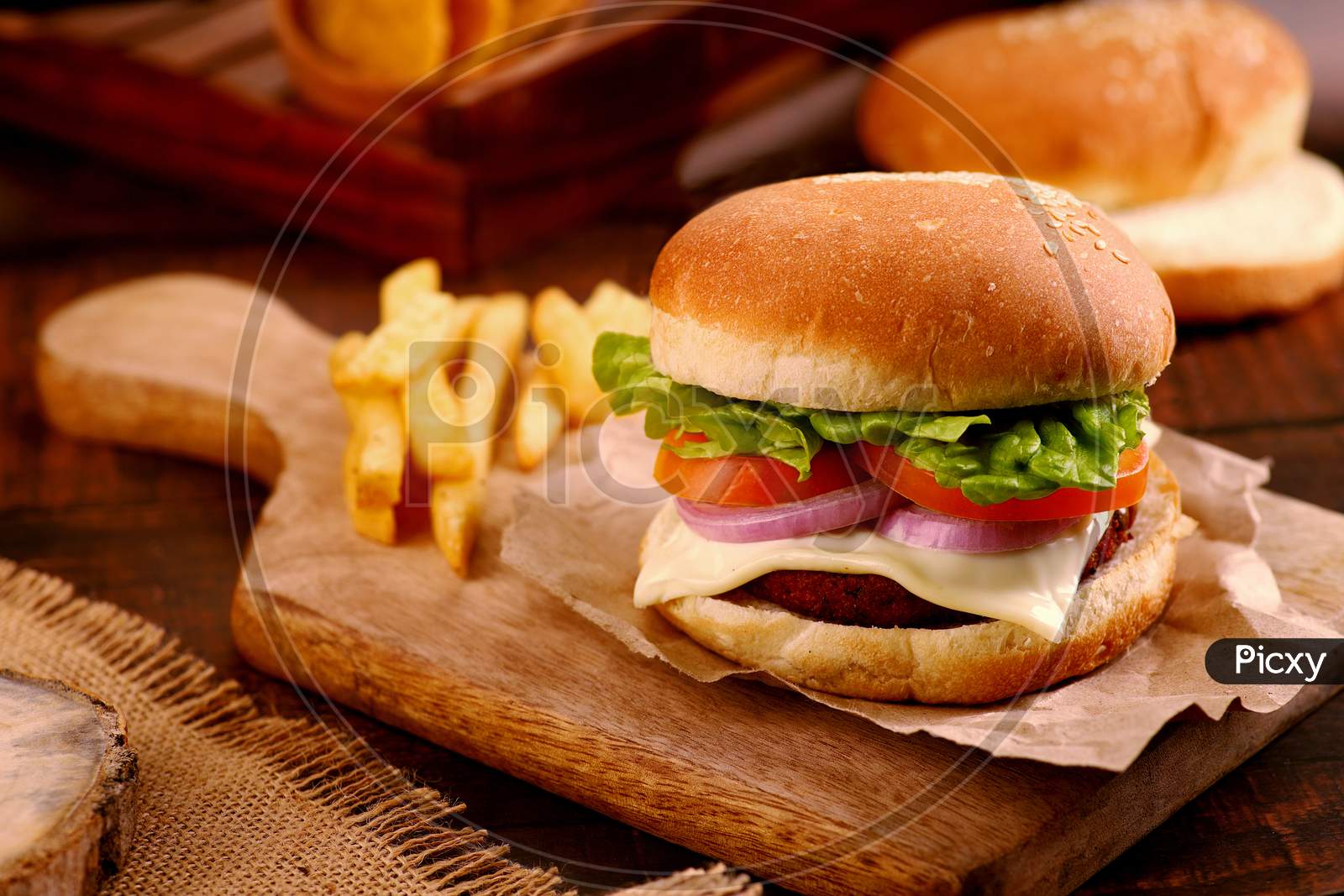 Fast Food Burger On A Wooden Platter And Table