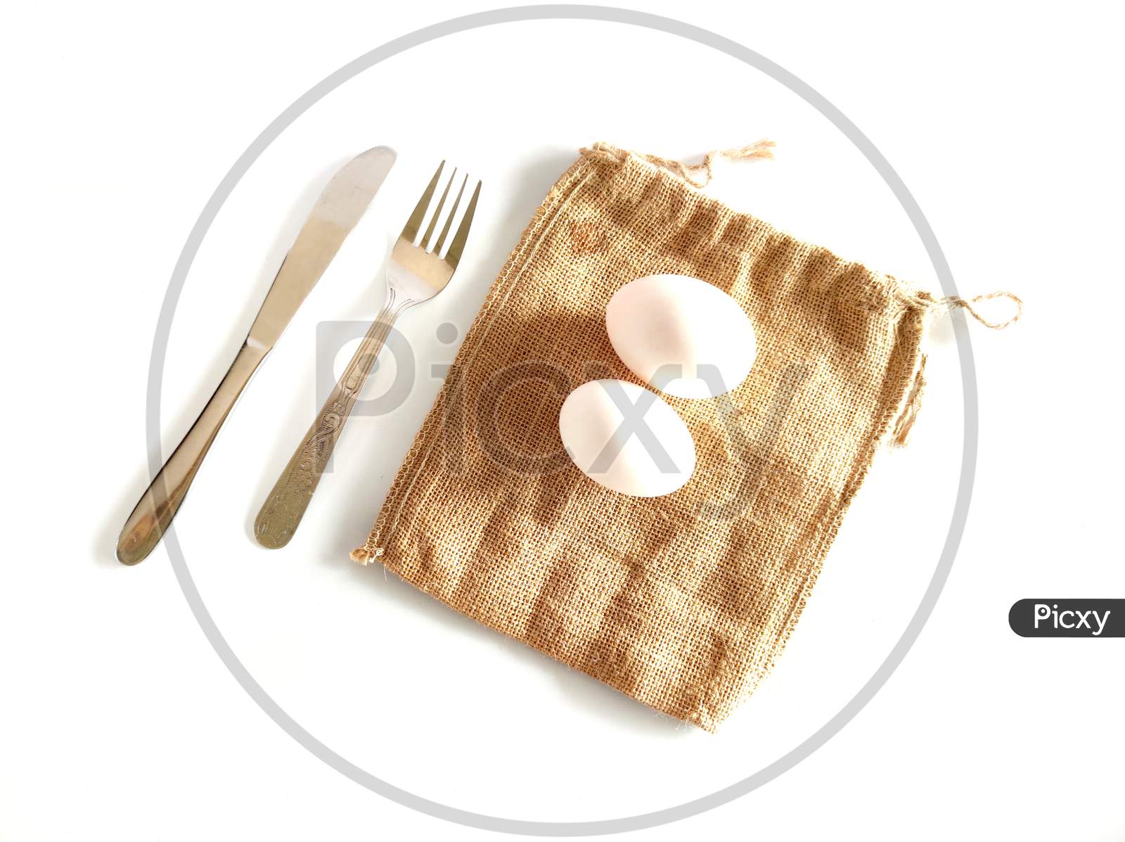 Egg Fork And Spoon On Top Of Table
