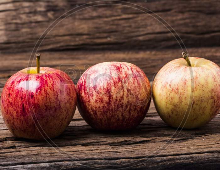 Fresh Red Apples On Wooden Background
