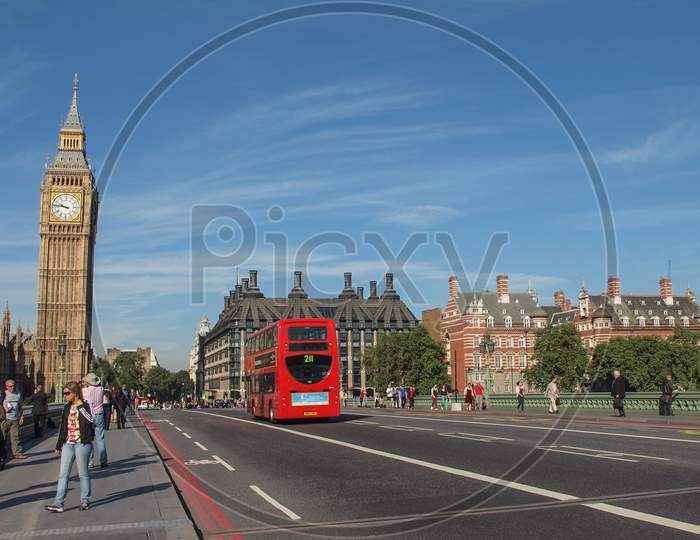 London, England, Uk - September 08, 2012: Tourists And A Traditional Double Decker Red Bus Crossing Westminster Bridge On September 8, 2012 In London, England, Uk