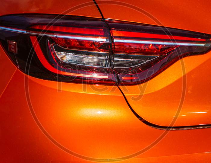 Orange Car Taillights. Exterior Detail. Close Up Detail On One Of The Led Taillights Modern Car.