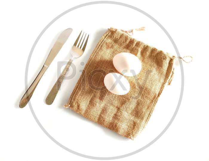 Egg Fork And Spoon On Top Of Table