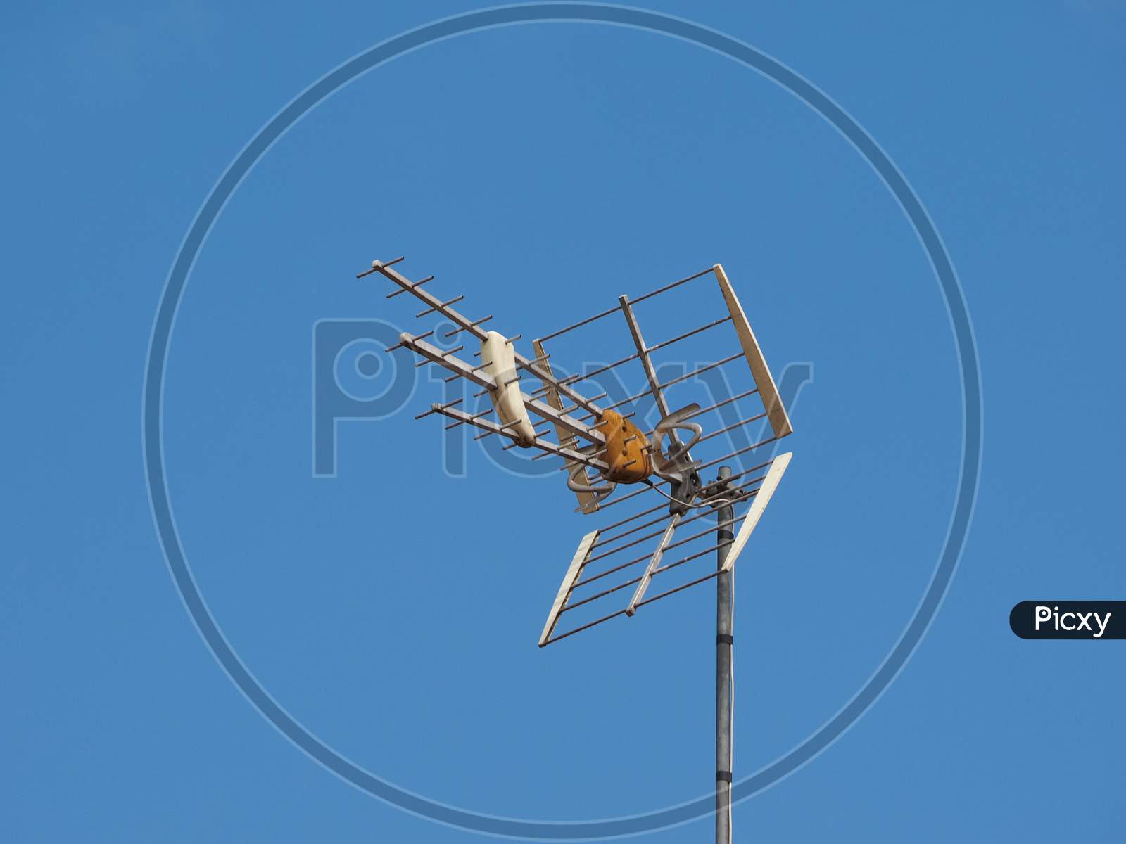 Tv Antenna Aerial Over Blue Sky With Copy Space