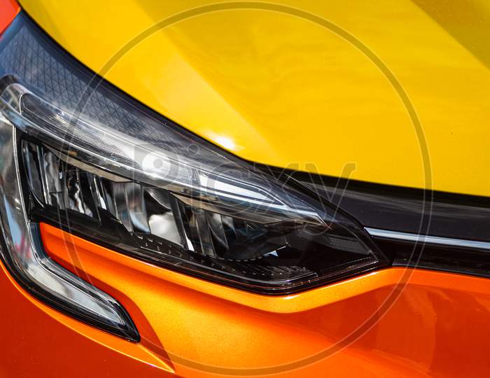 Orange Car Headlights. Exterior Detail. Close Up Detail On One Of The Led Headlights Modern Car.