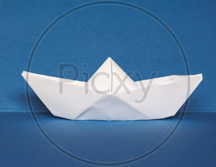 Paper Boat Over Blue