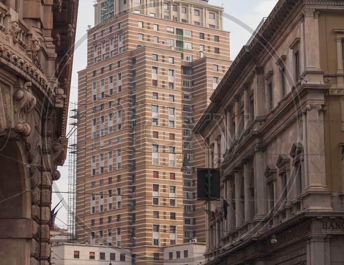 Genoa, Italy - March 16, 2014: The Torre Piacentini Skyscraper Designed By Architect Marcello Piacentini In Rationalist Style In 1935 Was The Highest Building In Italy At The Time Of Its Construction