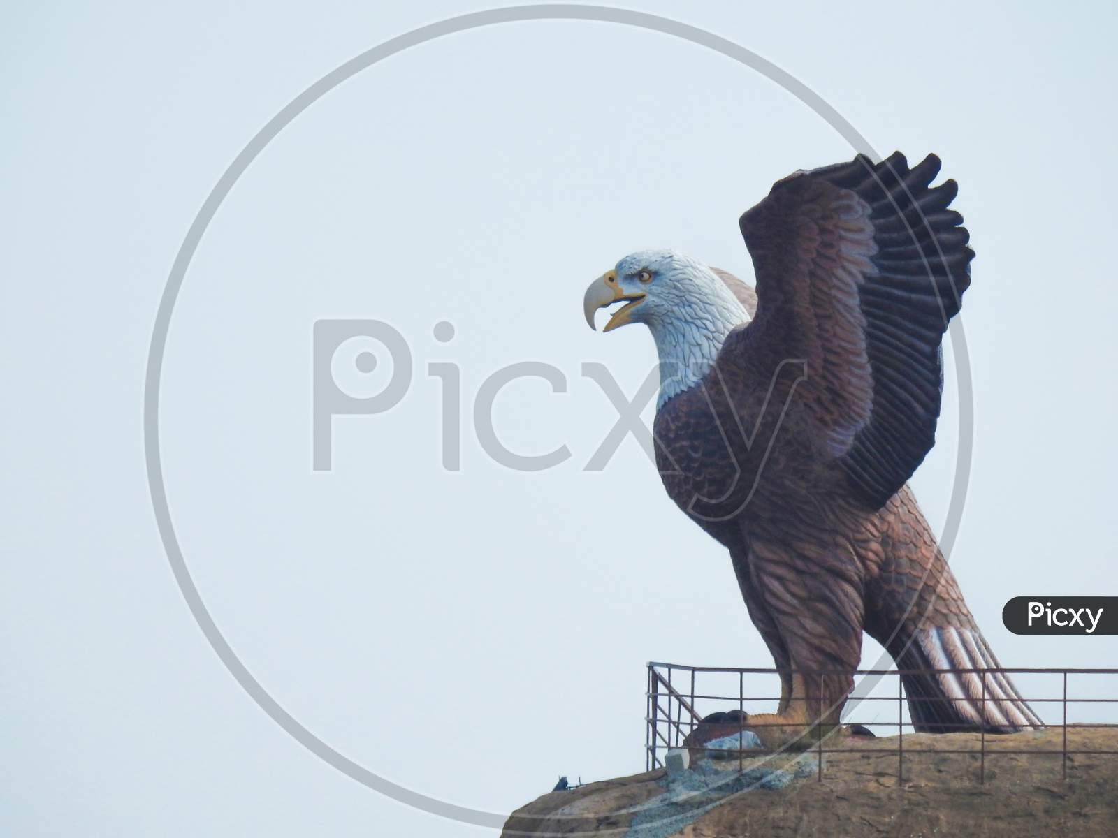 Closeup of beautiful attraction huge statue open wing Eagle or Jatayu Park at Lepakshi above the rock